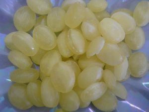 Traditional hard boiled oval lemon flavoured sweets with a slither of sherbet in the middle